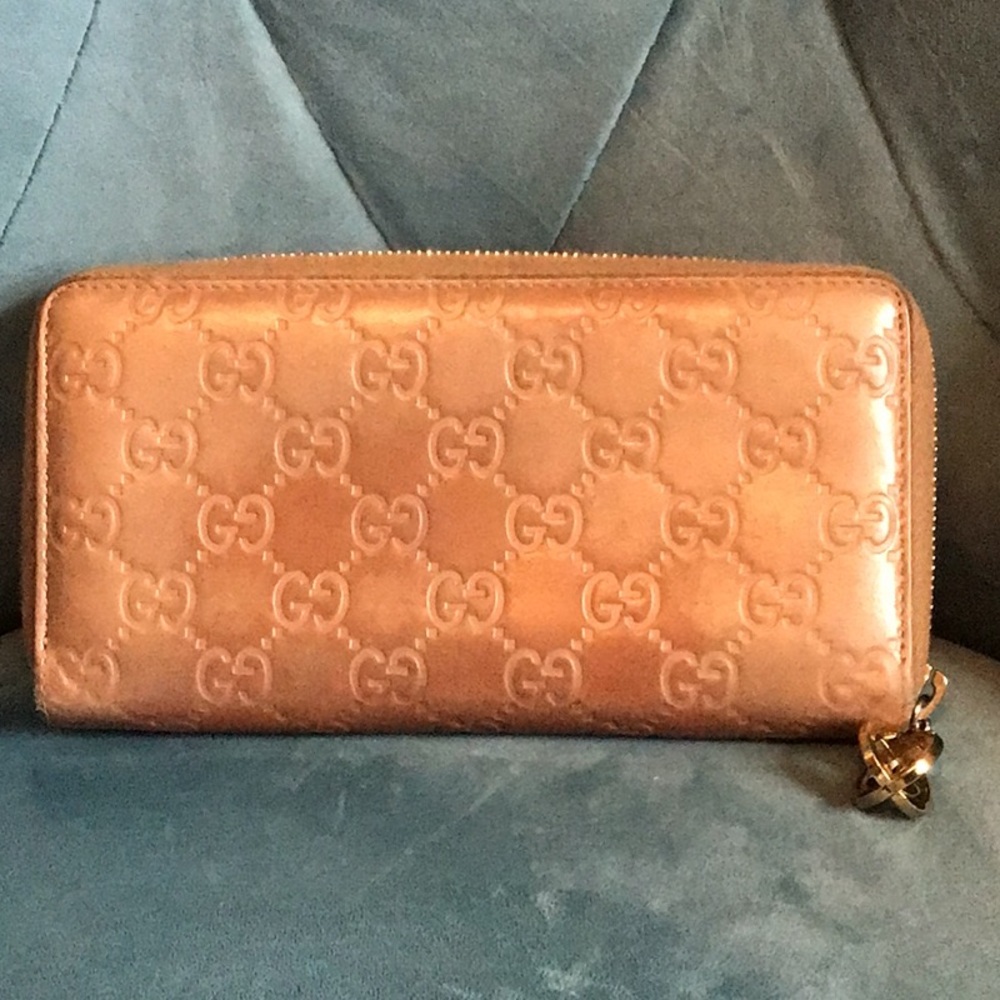 Gold toned Gucci zip around long wallet